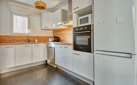 Villa Cano: Kitchen, Countertop, Cabinetry, Kitchen Appliance, Major Appliance, Flooring, Interior Design, Wood, Home Appliance, Ceiling
