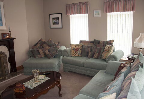 Eagle View Holiday Home: Furniture, Interior Design, Couch, Wood, Living Room, Flooring, Textile, Room, Floor, Lighting
