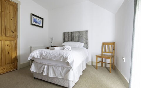Rhea Holiday Home Bantry: Bedroom, Bed, Wood, Bedding, Bed Sheet, Furniture, Floor, Interior Design, Ceiling, Flooring