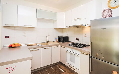 Marlen: Kitchen Appliance, Kitchen, Countertop, Major Appliance, Cabinetry, Kitchen Stove, Interior Design, Furniture, Wood, Flooring