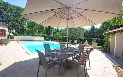 Les Pierres Fleuries: Furniture, Umbrella, Chair, Outdoor Furniture, Table, Swimming Pool, Shade, Outdoor Table, Kitchen & Dining Room Table, Resort