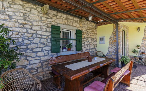 Marija: Wall, Wood, Stone Wall, Door, Furniture, Cottage, Flagstone, Chair, Porch, Outdoor Furniture