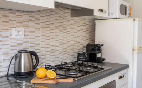 Casa La Conchiglia: Kitchen, Countertop, Kitchen Appliance, Interior Design, Wood, Flooring, Major Appliance, Home Appliance, Cabinetry, Floor