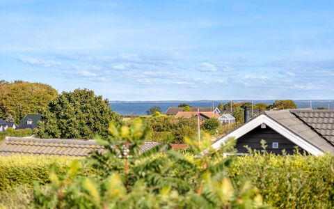 Tjarven - 350M from the Sea: Sky, Blue, Green, Shrub, Landscape, Cloud, Home, Sunlight, Cottage, Suburb