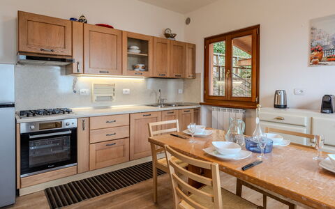 Graziella: Furniture, Kitchen, Cabinetry, Countertop, Kitchen Appliance, Interior Design, Flooring, Wood, Major Appliance, Cupboard