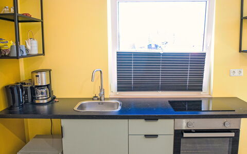 Schnakenberg: Kitchen, Kitchen Appliance, Yellow, Countertop, Interior Design, Furniture, Flooring, Major Appliance, Cabinetry, Lighting