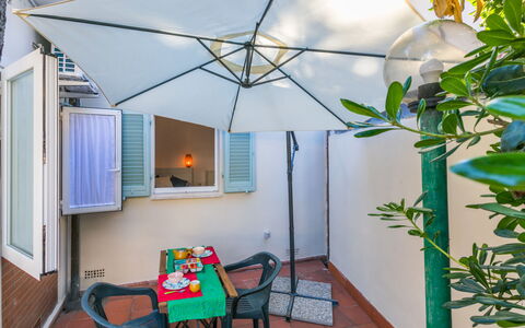 La Casetta: Furniture, Chair, Outdoor Furniture, Outdoor Table, Shade, Houseplant, Flowerpot, Kitchen & Dining Room Table, Balcony, Patio