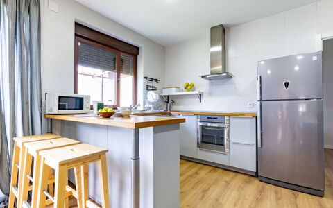 La Isla: Kitchen, Kitchen Appliance, Furniture, Major Appliance, Flooring, Interior Design, Countertop, Wood, Cabinetry, Home Appliance