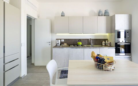 Timo: Furniture, Kitchen, Interior Design, Countertop, Kitchen Appliance, Flooring, Cabinetry, Wood, Major Appliance, Floor