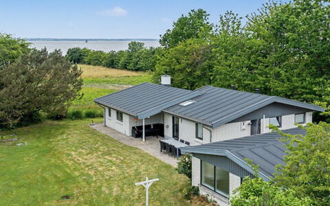 Sigbrit - 100M from the Sea: Roof, House, Home, Cottage, Siding, Estate, Driveway, Garden Buildings, Yard, Shed
