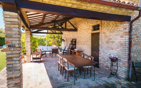 Villa Incanto: Furniture, Outdoor Table, Chair, Outdoor Furniture, Shade, Outdoor Structure, Porch, Brick, Patio, Column