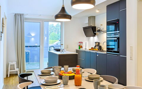 Abenteuerland: Interior Design, Furniture, Kitchen, Flooring, Countertop, Ceiling, Light Fixture, Kitchen Appliance, Room, Lighting
