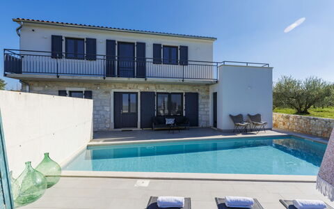 Villa Tiamo: Blue, Sky, Residential Area, Swimming Pool, Home, Composite Material, Estate, Villa, Resort, Shade