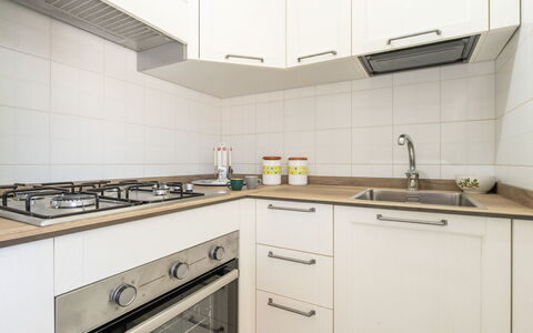 Carigi: Kitchen, Countertop, Kitchen Appliance, Major Appliance, Wood, Interior Design, Cabinetry, Flooring, Kitchen Stove, Stove