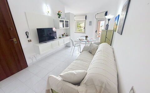Carigi: Flooring, Interior Design, Furniture, Floor, Couch, Room, Apartment, Living Room, Home