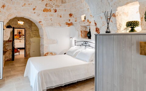 Trulli di Luccio: Apartment, Bedroom, Ceiling, Bedding, Stone Wall, Bed, Bed Frame, Bed Sheet, Linens, Pillow