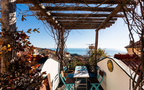 Terrazza con Glicine: Balcony, Chair, Outdoor Furniture, Outdoor Table, Eco Hotel, Houseplant