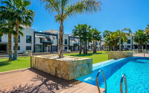 Oasis Beach 1: Building, Residential Area, Window, House, Home, Roof, Architecture, Neighbourhood, Facade, Town