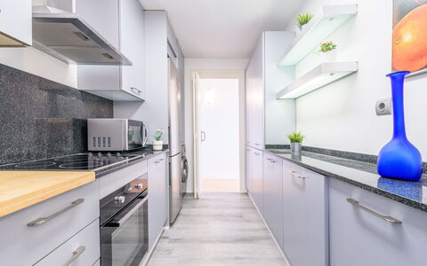 Del Sol: Kitchen, Countertop, Interior Design, Major Appliance, Flooring, Kitchen Appliance, Cabinetry, Floor, Furniture, Home