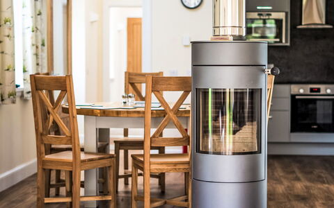 Corrimony View: Flooring, Wood Flooring, Wood-Burning Stove, Hardwood, Design, Living Room, Wood Stain, Hearth, Chair, Chimney