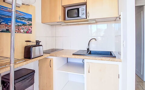 Villa Botrel: Furniture, Apartment, Chair, Major Appliance, Shade, Wood Stain, Balcony, Cabinetry, Countertop, Kitchen & Dining Room Table
