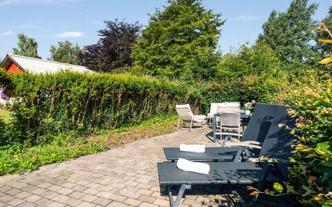 Hjalma - 250M to the Fjord: Green, Shrub, Outdoor Furniture, Garden, Furniture, Shade, Groundcover, Chair, Landscaping, Lawn