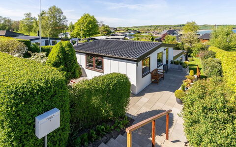 Martti - 200M from the Sea: Shrub, House, Roof, Home, Residential Area, Garden, Cottage, Landscaping, Estate, Hedge
