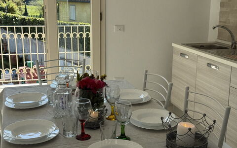 Villa al Glicine: Furniture, Tableware, Interior Design, Table, Flooring, Kitchen & Dining Room Table, Chair, Dining Room, Lighting, Serveware