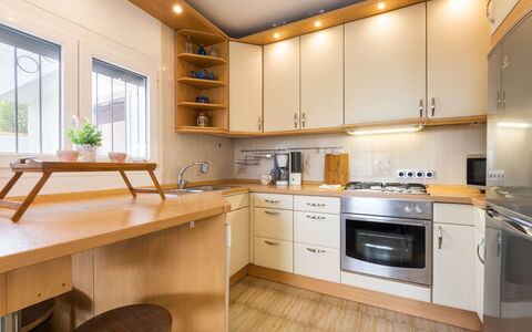 Vita: Furniture, Kitchen, Countertop, Kitchen Appliance, Cabinetry, Interior Design, Flooring, Major Appliance, Wood, Light Fixture