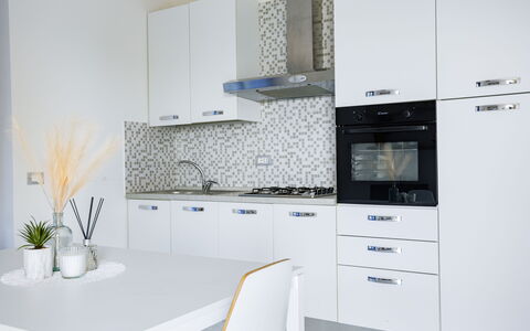 Villa Altavista: Kitchen, Countertop, Major Appliance, Cabinetry, Kitchen Appliance, Wood, Interior Design, Flooring, Kitchen Stove, Home