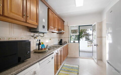 Jade-Sunny Way: Kitchen, Countertop, Flooring, Wood, Cabinetry, Furniture, Floor, Interior Design, Major Appliance, Home