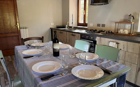 Villa Vindelbono: Furniture, Wood, Interior Design, Table, Flooring, Kitchen & Dining Room Table, Chair, Lighting, Kitchen, Room