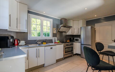 Villa Elica: Kitchen, Kitchen Appliance, Countertop, Major Appliance, Furniture, Interior Design, Flooring, Cabinetry, Wood, Ceiling