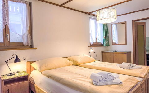 Chalet Graf Apt 1: Bed, Bedroom, Interior Design, Wood, Bed Sheet, Floor, Bedding, Furniture, Flooring, Bed Frame
