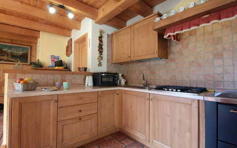 Chalet Genzianella: Furniture, Kitchen, Flooring, Countertop, Cabinetry, Interior Design, Wood, Floor, Room, Ceiling