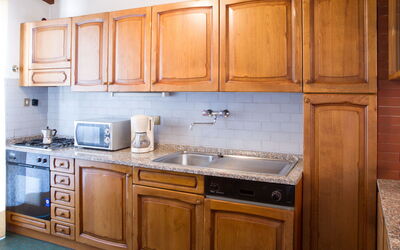 Corte Apt Sup: Kitchen, Cabinetry, Countertop, Kitchen Appliance, Wood, Major Appliance, Flooring, Interior Design, Cupboard, Sink