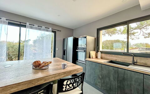 Villa Dune: Furniture, Countertop, Interior Design, Kitchen, Flooring, Wood, Cabinetry, Floor, Ceiling, Lighting