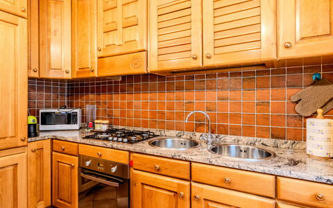 House Bigio: Kitchen, Countertop, Kitchen Appliance, Cabinetry, Major Appliance, Flooring, Interior Design, Plumbing Fixture, Sink, Kitchen Sink