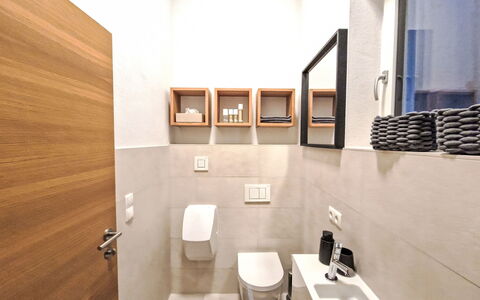 The Rock Design: Flooring, Wall, Interior Design, Floor, Plumbing Fixture, Toilet, Toilet Seat, Wood, Bathroom, Plumbing