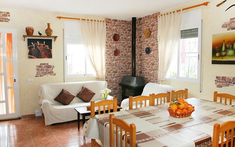 Masia del Mosso: Room, Property, Interior Design, Furniture, Living Room, Orange, Building, Wall, Dining Room, Table