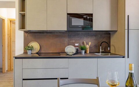 Zena Apartment: Countertop, Kitchen, Furniture, Kitchen Appliance, Cabinetry, Interior Design, Flooring, Wood, Home, Home Appliance