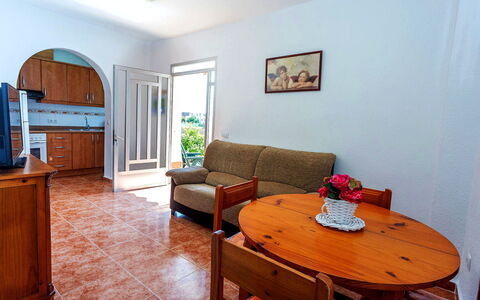 Valenciano: Table, Cabinetry, Furniture, Property, Couch, Wood, Comfort, Interior Design, Picture Frame, Flooring