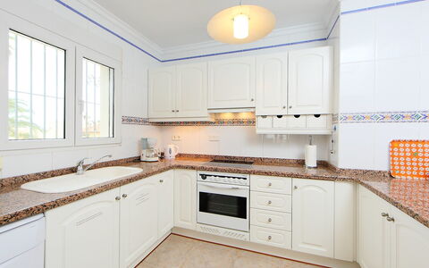 Tossal Gros: Property, Countertop, Room, Kitchen, Cabinetry, Furniture, Yellow, Real Estate, Interior Design, Building