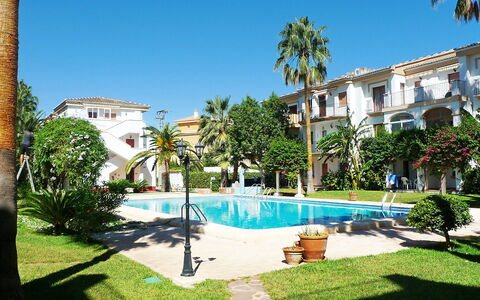 El Patio: Plant, Sky, Building, Property, Water, Window, Tree, Arecales, Swimming Pool, House