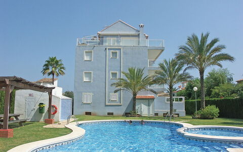 Turquesa: Water, Plant, Sky, Building, Property, Azure, Tree, Swimming Pool, Body Of Water, Architecture