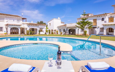 Pueblo Andaluz: Water, Cloud, Sky, Property, Swimming Pool, Building, Plant, Blue, Azure, Outdoor Furniture