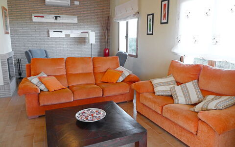 Villa Corona: Living Room, Furniture, Room, Couch, Orange, Property, Interior Design, Table, Home, Sofa Bed