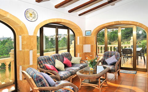 Tarraula: Furniture, Property, Plant, Couch, Houseplant, Porch, Chair, Window, Wood, Shade