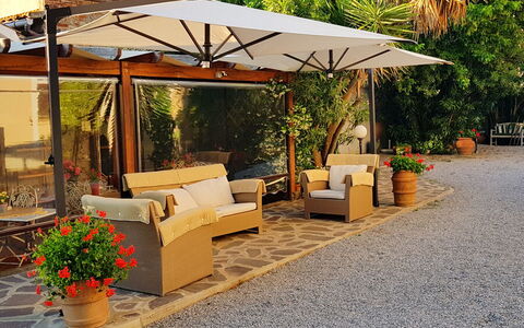 Suite Orchidea Seaside and Pool: Furniture, Flowerpot, Outdoor Furniture, Shade, Umbrella, Chair, Outdoor Table, Garden, Outdoor Structure