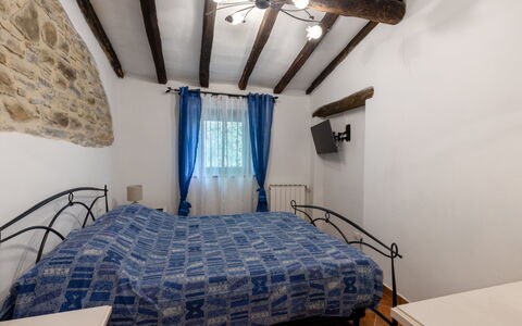 L'Oasi del Poggio: Wall, Bedroom, Bed, Furniture, Linens, Bedding, Bed Sheet, Interior Design, Home, Bed Frame